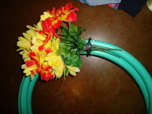 Securing the flowers to the hose. Use another twist tie to do this.